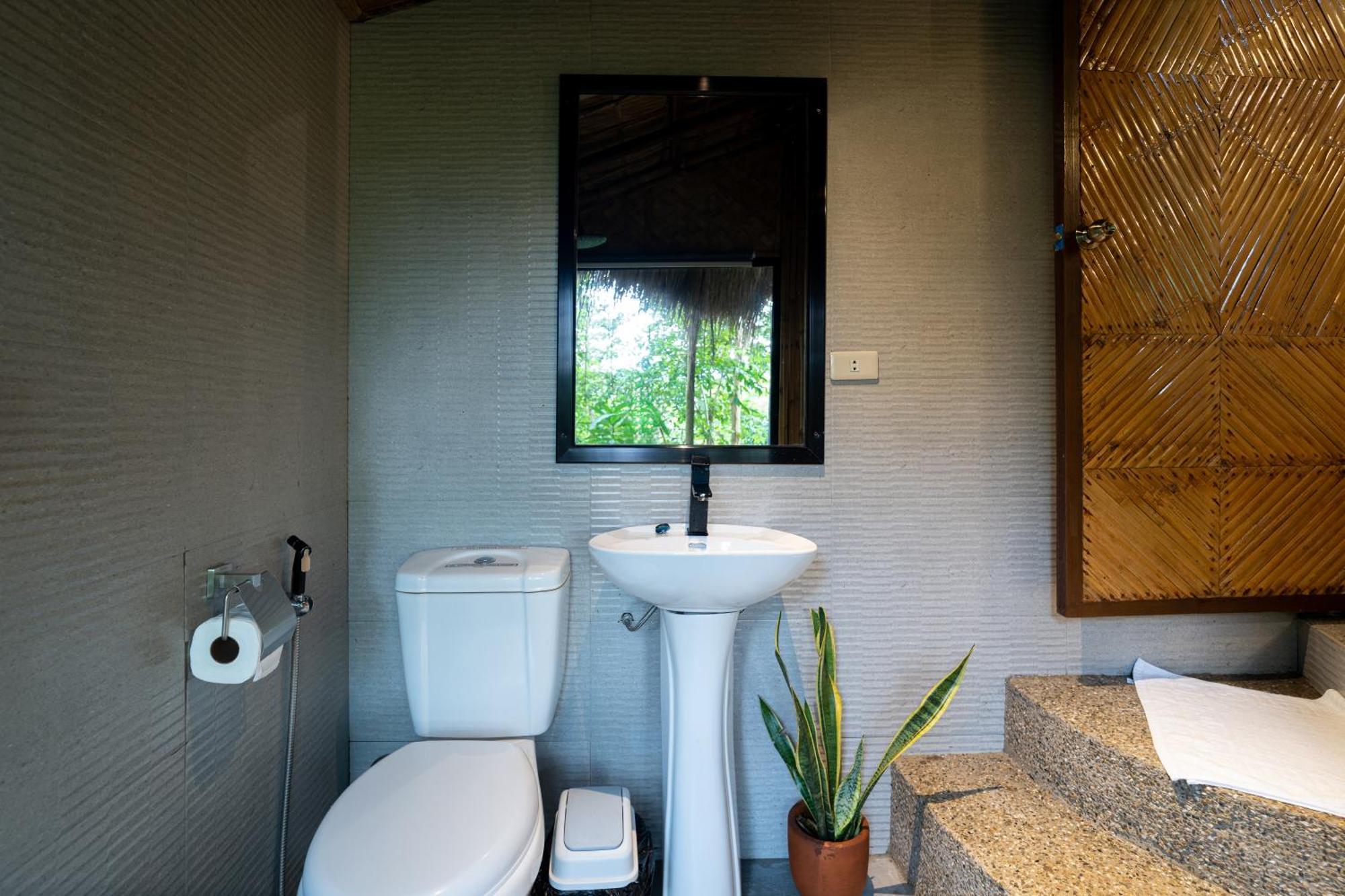 Inigtan Lio Bamboo Cottages Эль-Нидо Экстерьер фото